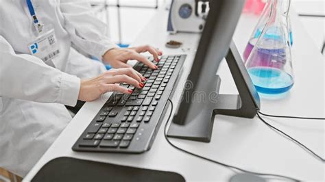 Regulatory specialist preparing a submission package on a laboratory computer